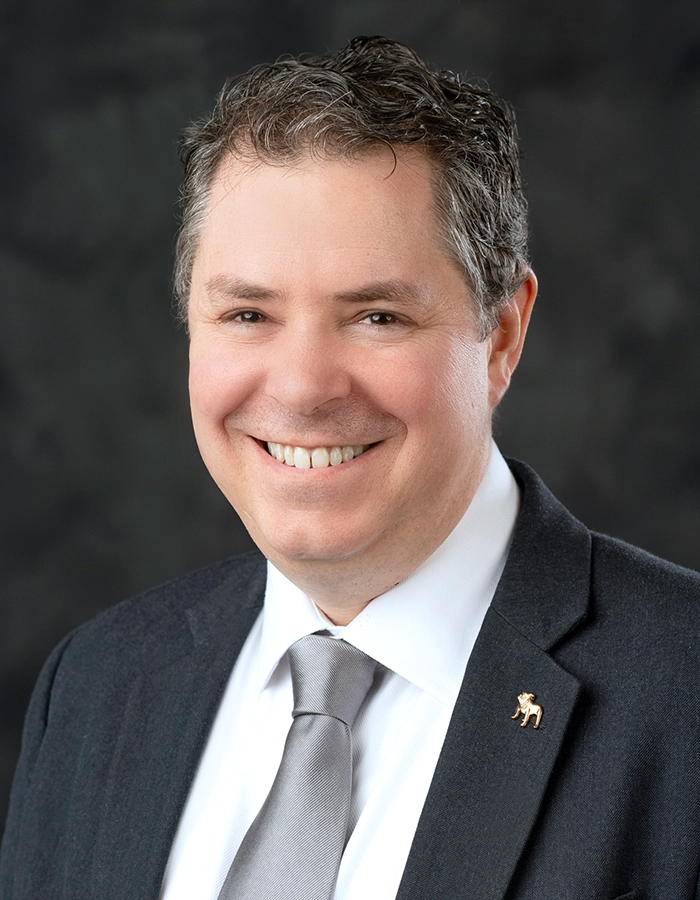 Formal studio headshot portrait of Thomas Broadus