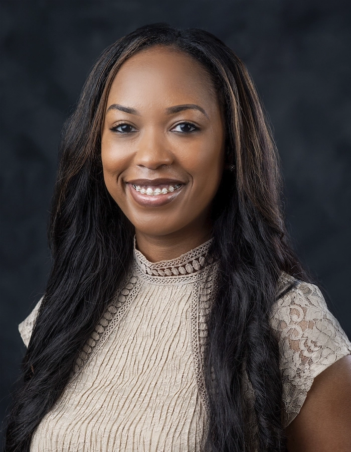 Formal studio headshot portrait of Jalana Caples